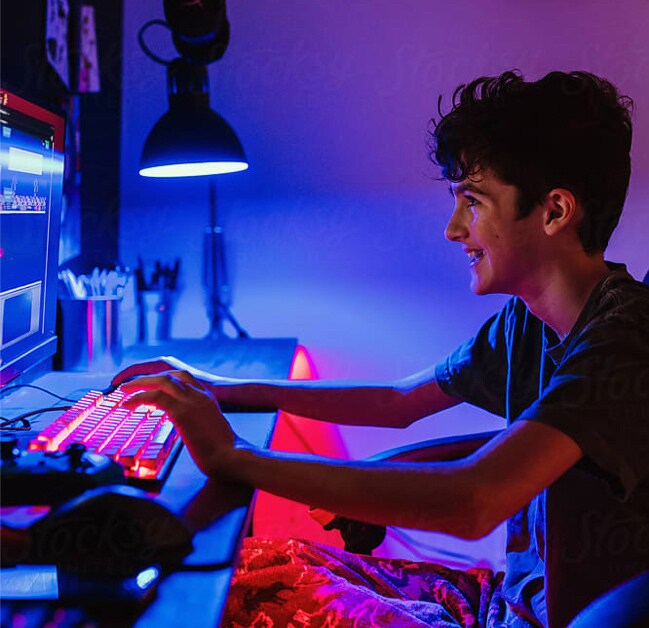 Teenager playing computer games