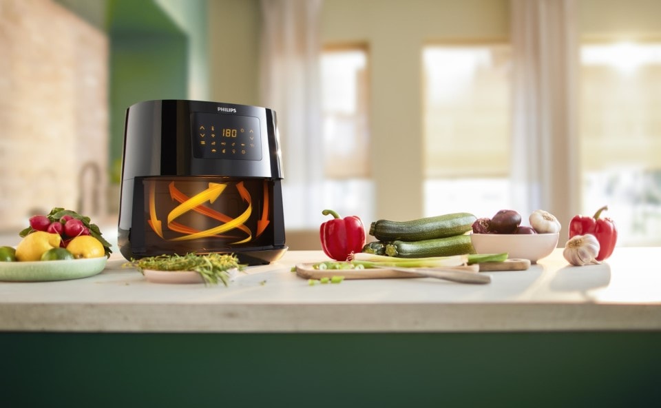 Airfryer Philips Ovi Smart używający powietrza, które dzięki ciągłej rotacji utrzymuje stałą, wysoką temperaturę. 