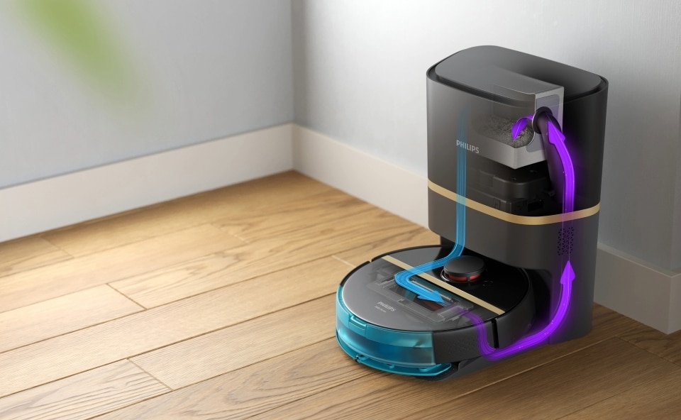 Robot sprzątający na stacji ładowania, automatycznie opróżniający się.